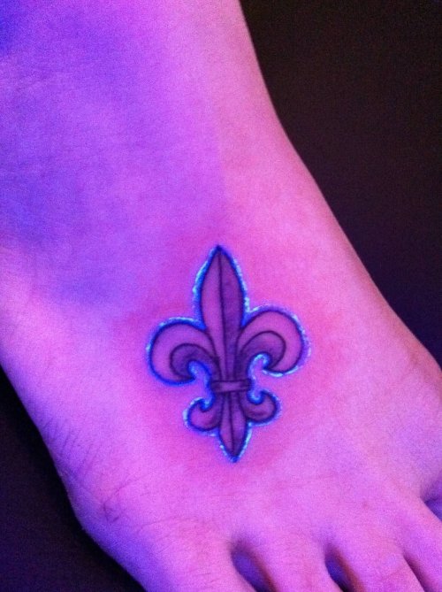 Fleur De Lis UV Tattoo On Foot